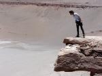 Sue peering over a precipice between Calama and San Pedro