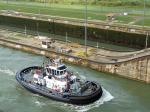 A tug makes its way through the locks.