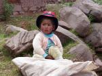 A child at the market town of Chinchero